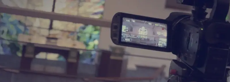 A video camera recording the worship service