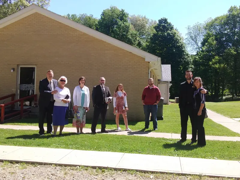 Members of Grace Baptist Church gathered on the lawn outside the church building