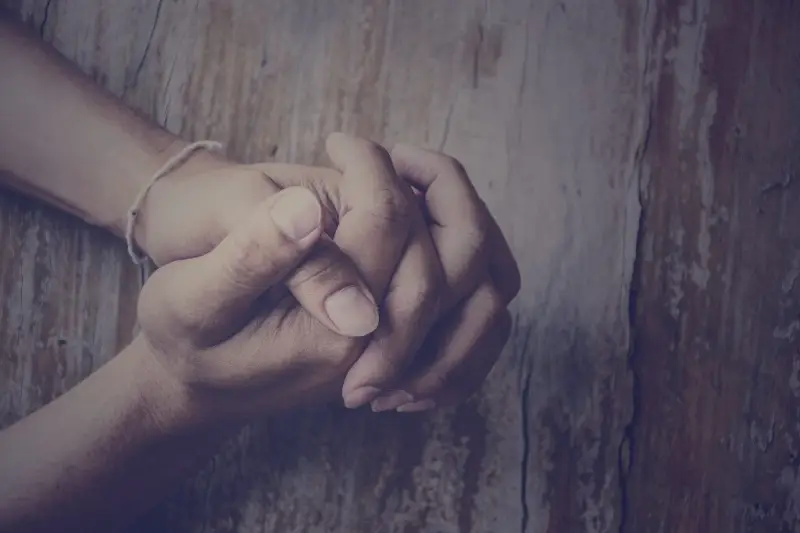 Hands folded in prayer